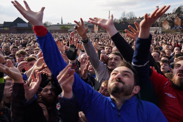 Players take part in the Royal Shrovetide Football Match in Ashbourne, Derbyshire, which has been played in the town since the 12th century 