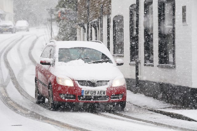 A motorist tackles a snowy road in Kent