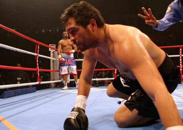 David Haye looks on after knocking down John Ruiz in the first round
