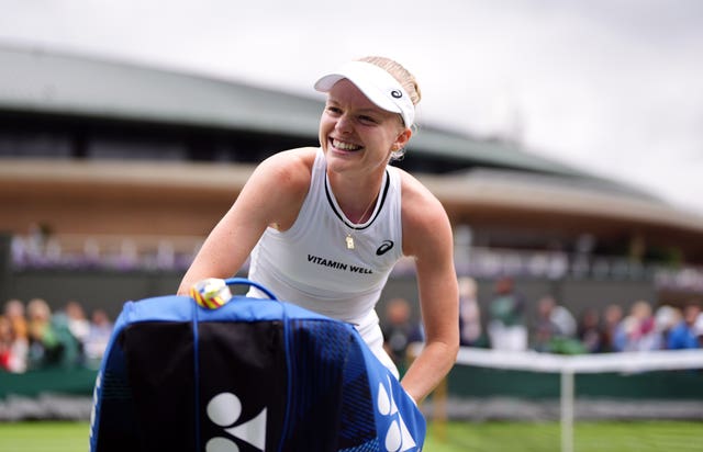Harriet Dart smiles at the crowd as she goes to pick up her bag after her victory