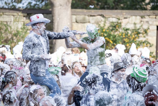 Students take part in the traditional Raisin Monday foam fight on St Salvator’s Lower College Lawn at the University of St Andrews in Fife in October