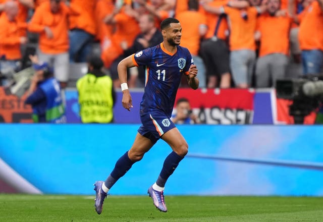 Netherlands forward Cody Gakpo celebrates scoring against Romania