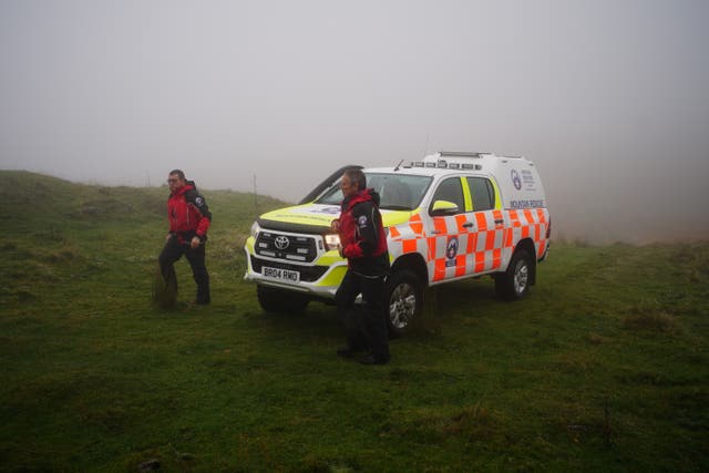 Rescuers at the entrance of the Ogof Ffynnon Ddu cave system near Penwyllt, Powys in the Brecon Beacons, Wales