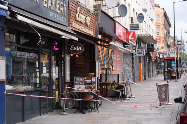 Police tape at the scene of a shooting at Kingsland High Street, Hackney, east London. 