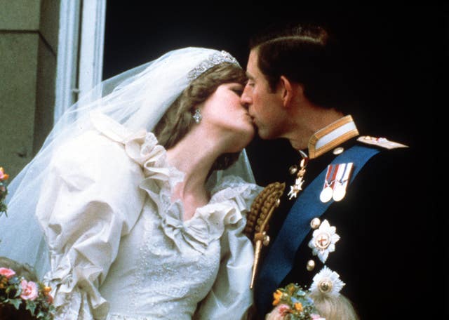 The Prince of Wales and his bride, Lady Diana Spencer, started the now traditional 'balcony kiss' (PA)