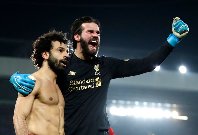 Liverpool goalkeeper Alisson Becker, right, says Mohamed Salah is 