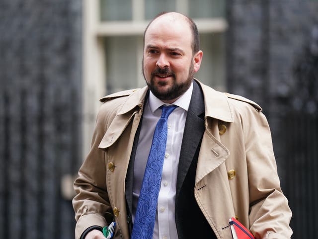 Conservative MP Richard Holden walks along Downing Street