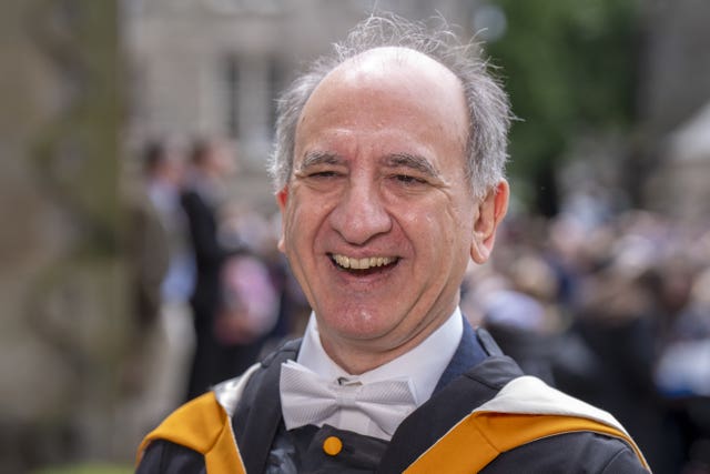 The Thick of It creator Armando Iannucci smiles after receiving an honorary degree from St Andrews University