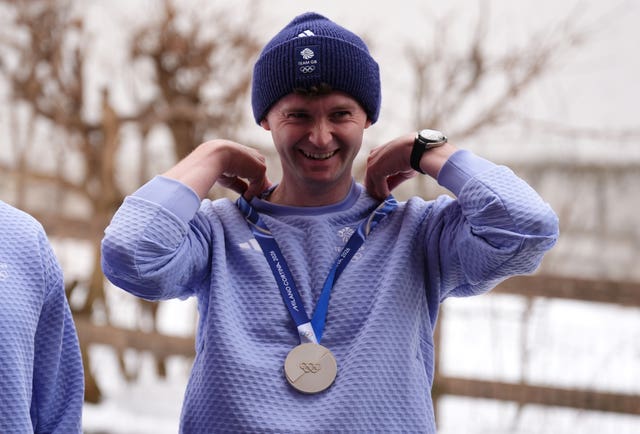 Great Britain’s Bruce Mouat with his silver medal in Cortina