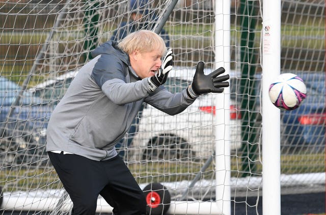 Boris Johnson tries his hand in goal before a football match between Hazel Grove Utd and Poynton Jnr u10s in the Cheshire Girls football league in Cheadle Hume 