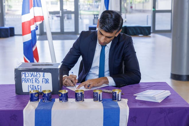 Prime Minister Rishi Sunak signing messages and prayers for Israel
