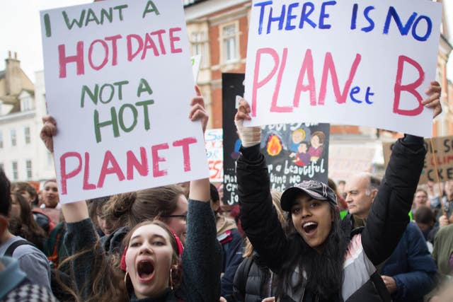 Students take part in a global school strike for climate change in Cambridge city centre (Stefan Rousseau/PA)