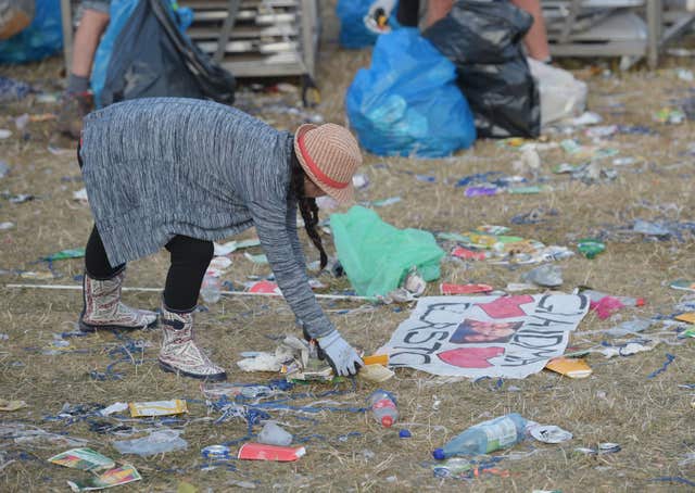 Rubbish is collected following the Glastonbury Festival (Ben Birchall/PA)