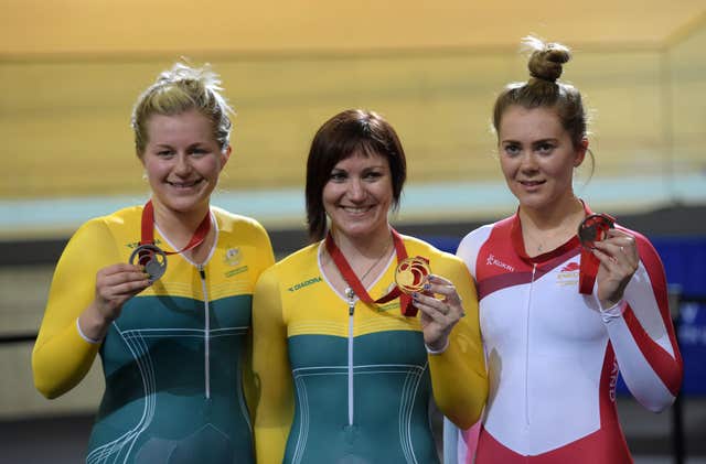 Varnish, right, collecting a bronze medal at the 2014 Commonwealth Games