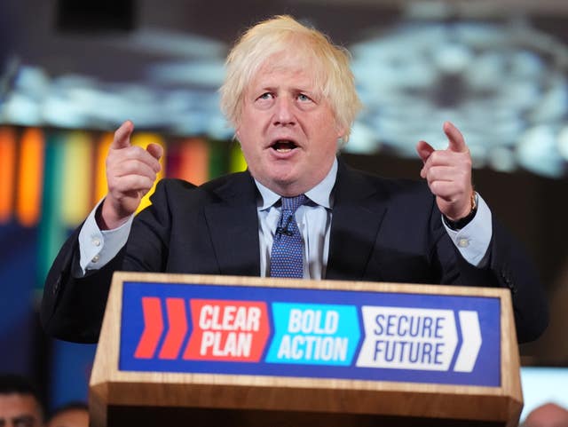 Boris Johnson speaking from behind a podium