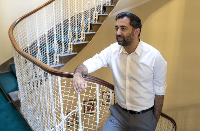 Humza Yousaf standing on stairwell