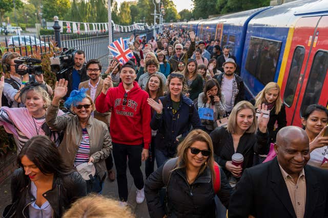 Royal fans arrive at Windsor & Eton Riverside Station (James Hardisty/PA)