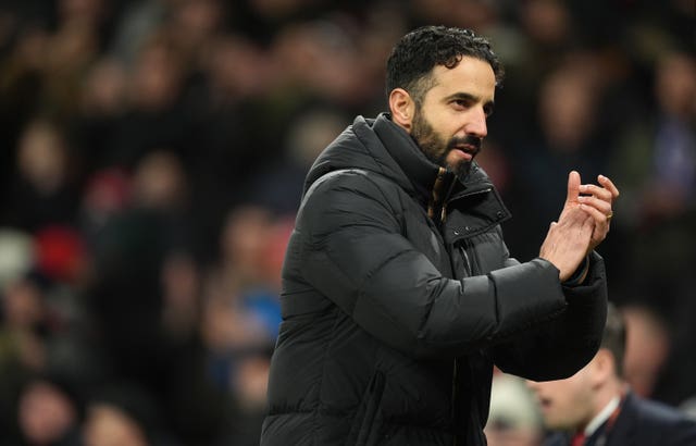 Manchester United manager Ruben Amorim applauds the fans after a Europa League match at Old Trafford