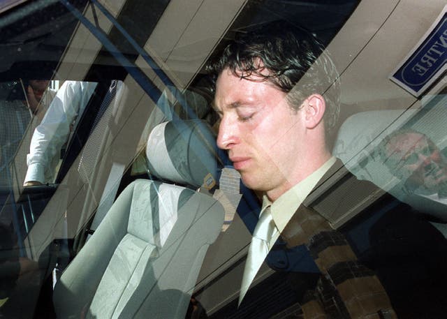 Robbie Fowler leaving a disciplinary tribunal after his celebration