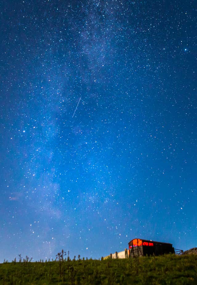 A meteor shower lights up the night sky