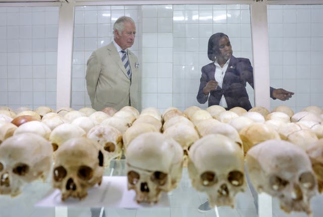 The Prince of Wales is shown the skulls of victims