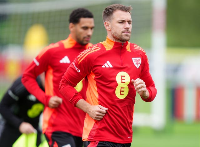 Wales captain Aaron Ramsey jobs during a training session