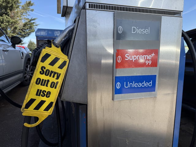 A label reading 'sorry out of use' on a petrol pump