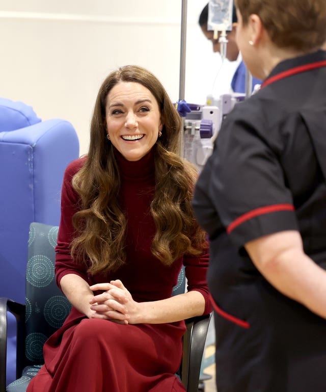 Kate smiles as she chats to hospital staff