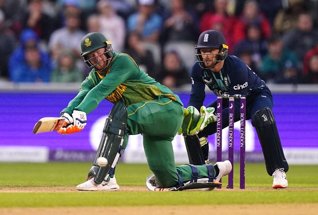 South Africa's Heinrich Klaasen stoops for a sweep shot as wicketkeeper Jos Buttler looks on.