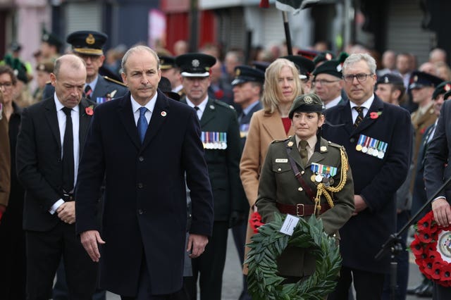 Taoiseach Michael Martin, centre left, at the cenotaph in Enniskillen 