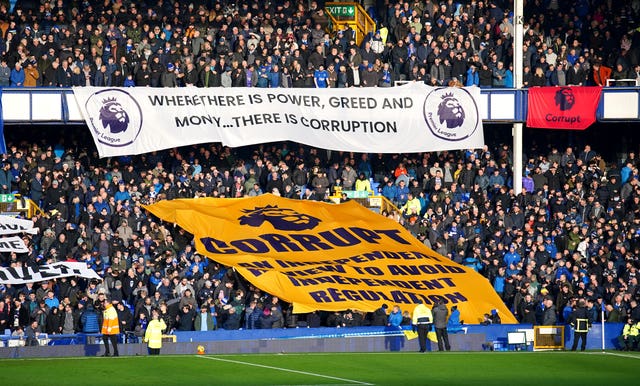 Everton fans, whose club have been docked points twice this season for breaching financial rules, protest against the Premier League 