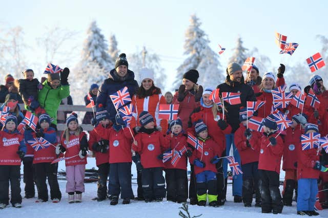 The Duke and Duchess of Cambridge (centre left) and Crown Prince Haakon and Princess Mette-Marit of Norway (centre right), prepare to leave after an event in Tryvann, Oslo, Norway, organised by the Norwegian Ski Federation, where they saw a group of local nursery children taking part in an afternoon ski school session on the slopes, on the final day of their tour of Scandinavia (Victoria Jones/PA)