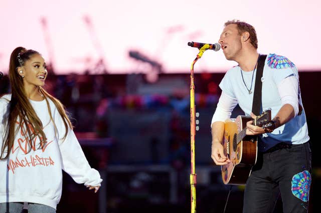 Ariana Grande performs with Chris Martin (Dave Hogan for One Love Manchester)