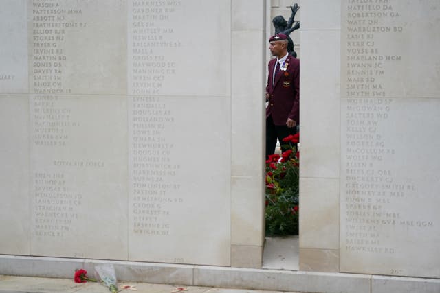 A member of the military observes the armed forces memorial