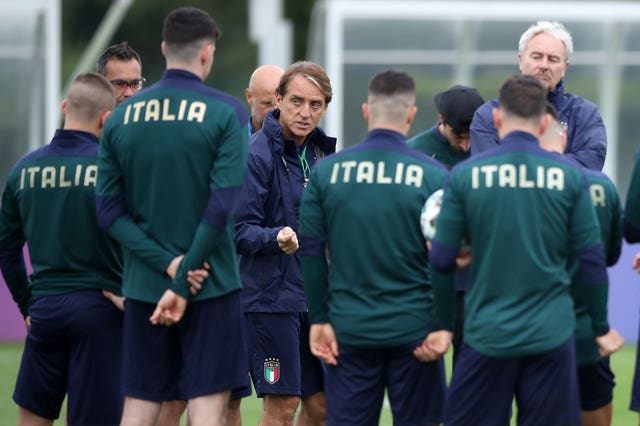 Italy manager Roberto Mancini with his players during a training session at Tottenham Hotspur's training ground