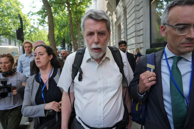 Gareth Jenkins leaves after giving evidence  at Aldwych House, central London