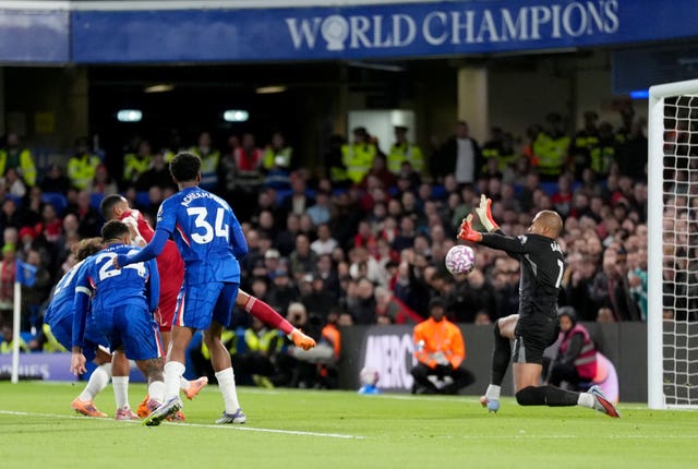 Cody Gakpo, rear left, scores Liverpool’s equaliser under pressure from Chelsea's Malo Gusto, Reece James and Josh Acheampong, left to right