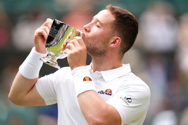 Alfie Hewett kisses the trophy