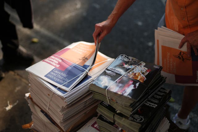 Copies of the final print of the London Evening Standard are taken by readers as the paper moves to weekly-only editions and a rebrand