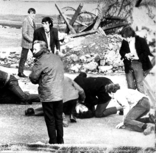 A man receiving attention during the Bloody Sunday shooting in Londonderry
