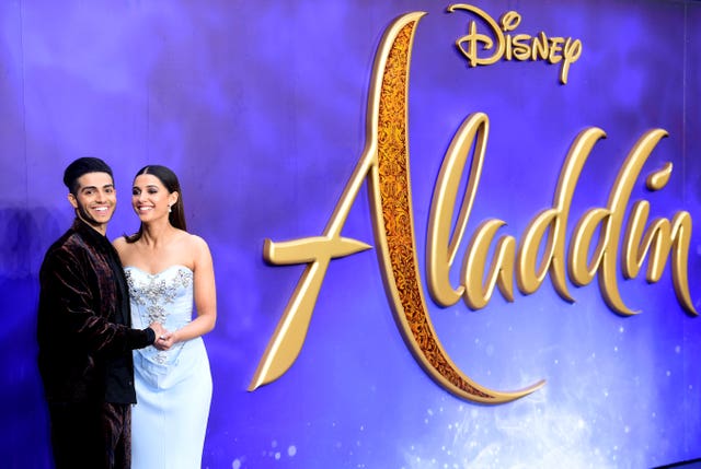 Mena Massoud, who plays Aladdin, and Naomi Scott, cast as Jasmine, arrive at the premiere (Ian West/PA) 