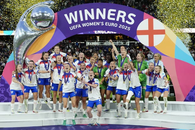 England’s Leah Williamson and Keira Walsh lift the trophy after Euro 2025 final victory over Spain