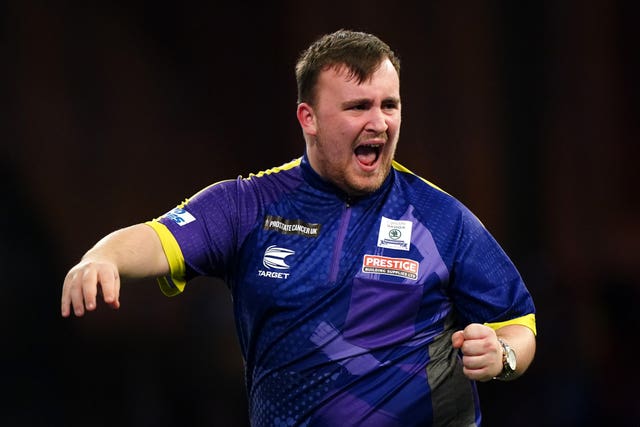 Luke Littler celebrates reaching the PDC World Championship semi-finals