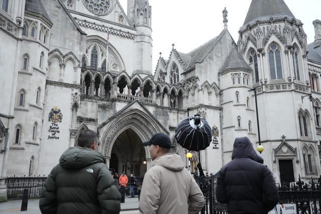 Media gather at the Royal Courts Of Justice, central London, for the trial 