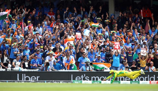 India fans celebrate as their side score another boundary at the Oval 