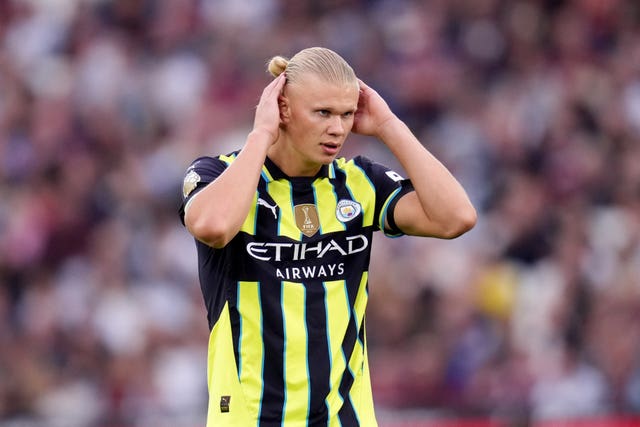 Erling Haaland holds his head during the Premier League match at West Ham 