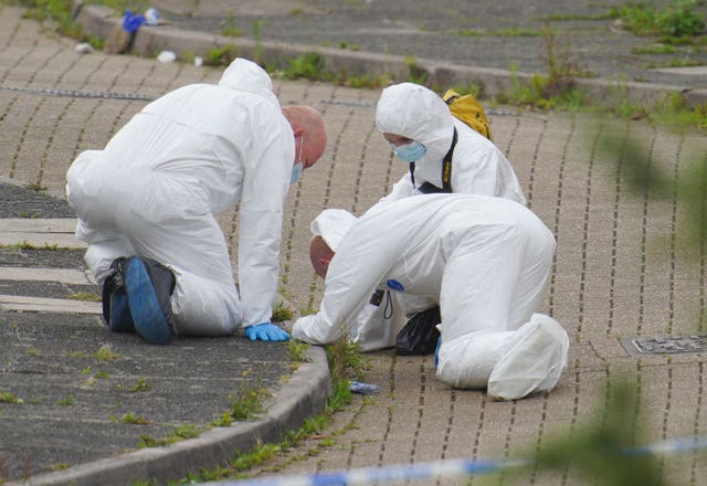Forensic officers working at the scene on Friday (Ben Birchall/PA)