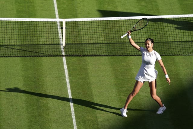 Emma Raducanu waves to Centre Court after her debut victory 