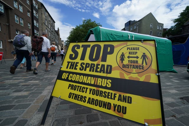 A yellow coronavirus sign in an Edinburgh  road
