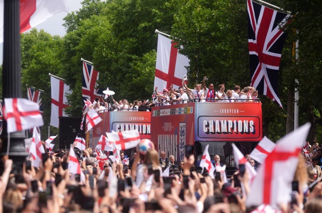England's players make their way down the Mall on an open-top bus